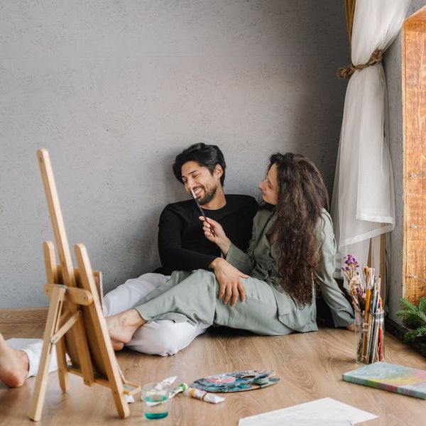 Person meditating in a bright room with natural light.